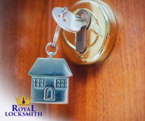 lock on door with dangling house keychain